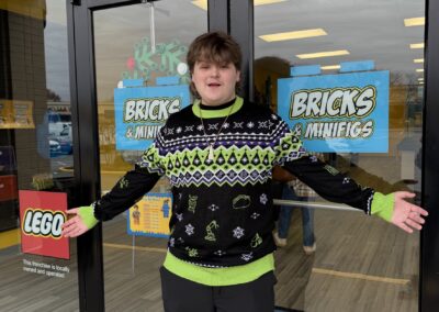 Eli Standing in Front of the store just after opening